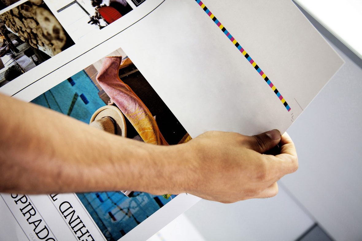 Man's,Hand,Checking,Color,Proofs,For,Printing,,During,Production